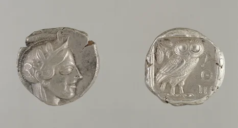 Both sides of a Drachma, featuring the head of Athena and an Owl, from Athens